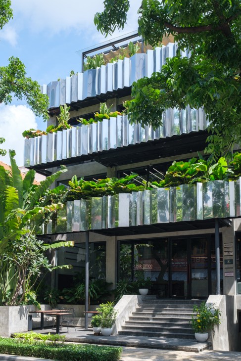 Interior of Vietcetera's new Ho Chi Minh City office featuring modern workspace with plants and natural light.