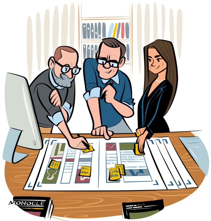 Illustration of three people collaborating at a wooden desk with design layouts and shelves of books in the background.