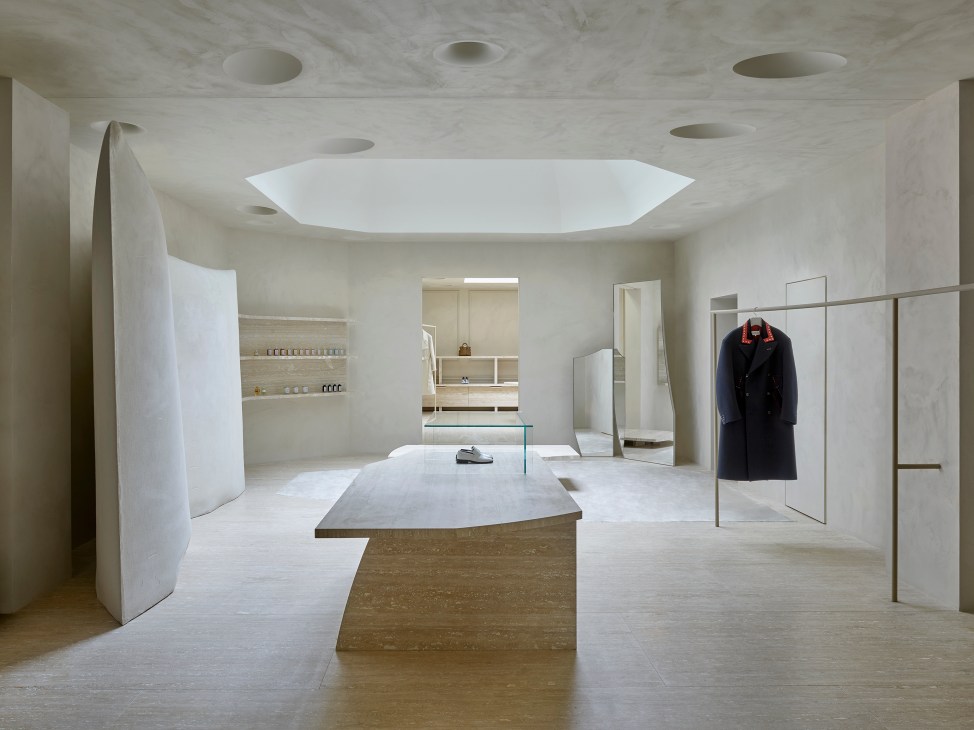 Interior of Maison Margiela store showing sculpted white gypsum walls and minimalist retail space