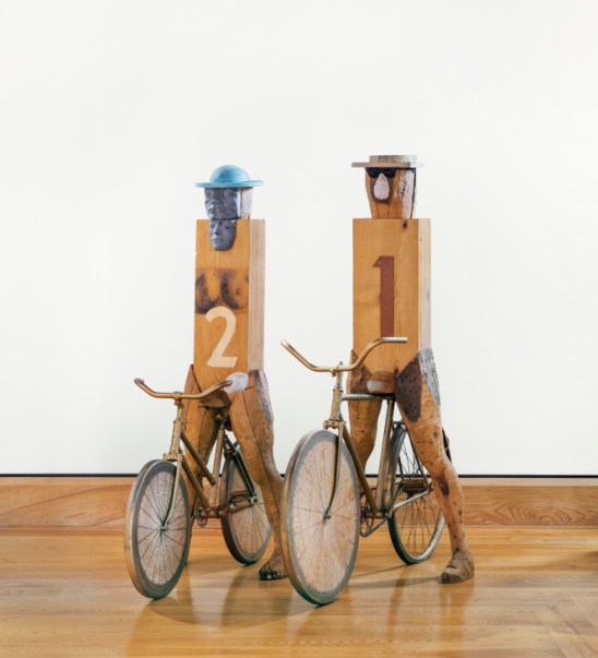 Mixed media sculpture showing geometric figures with painted faces