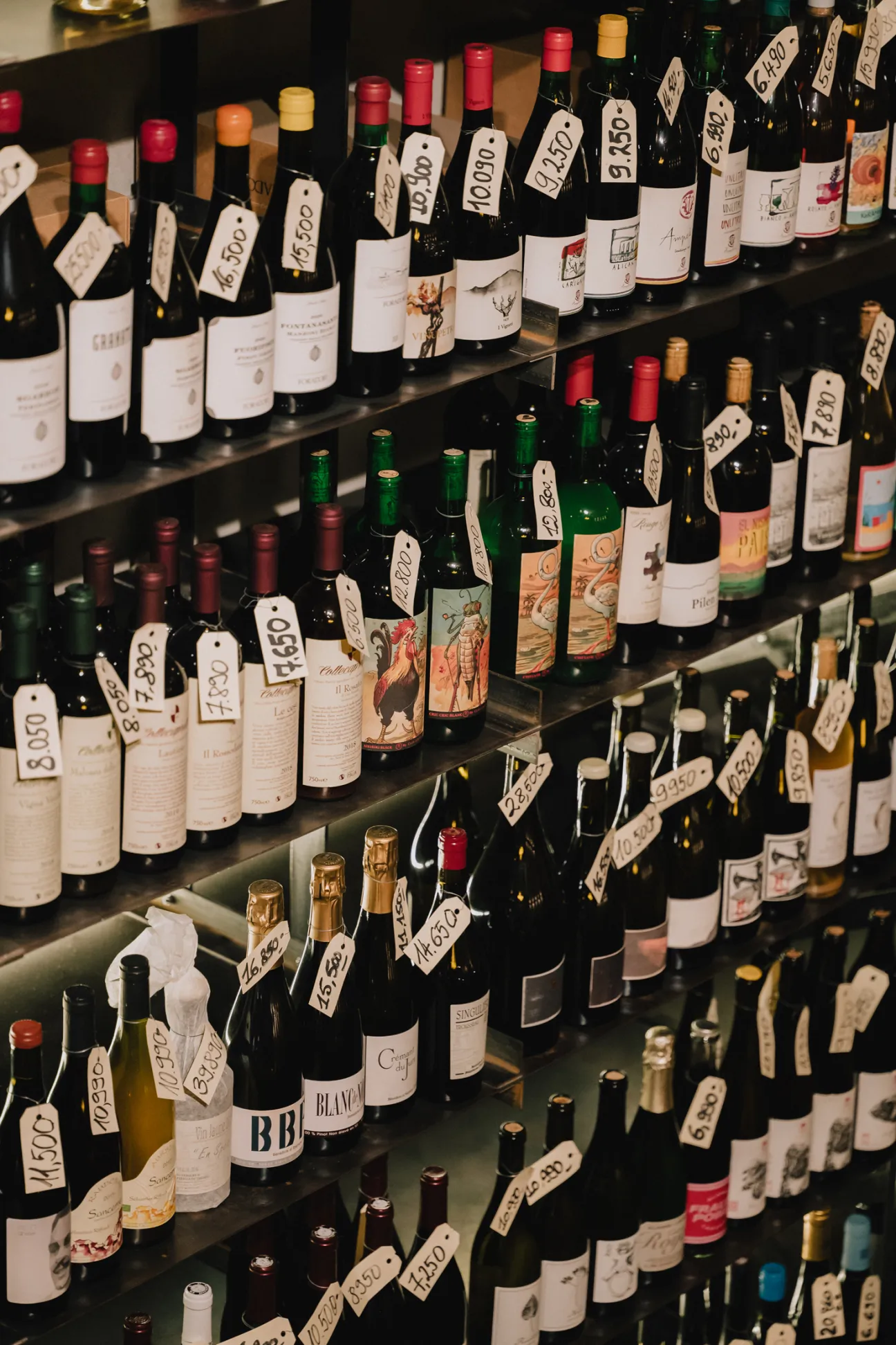 Close-up of Hungarian and French wine bottles at Marlou