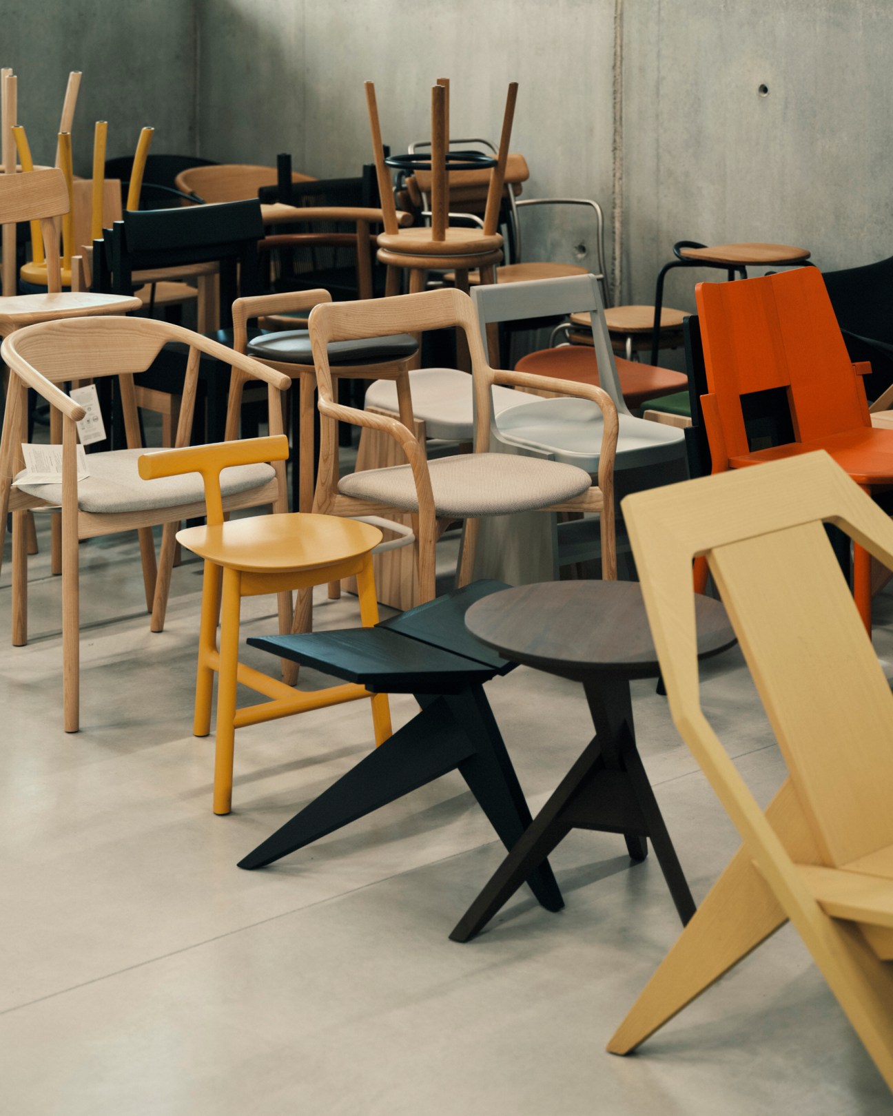 Display of various wooden chairs and furniture pieces from the Mattiazzi collection