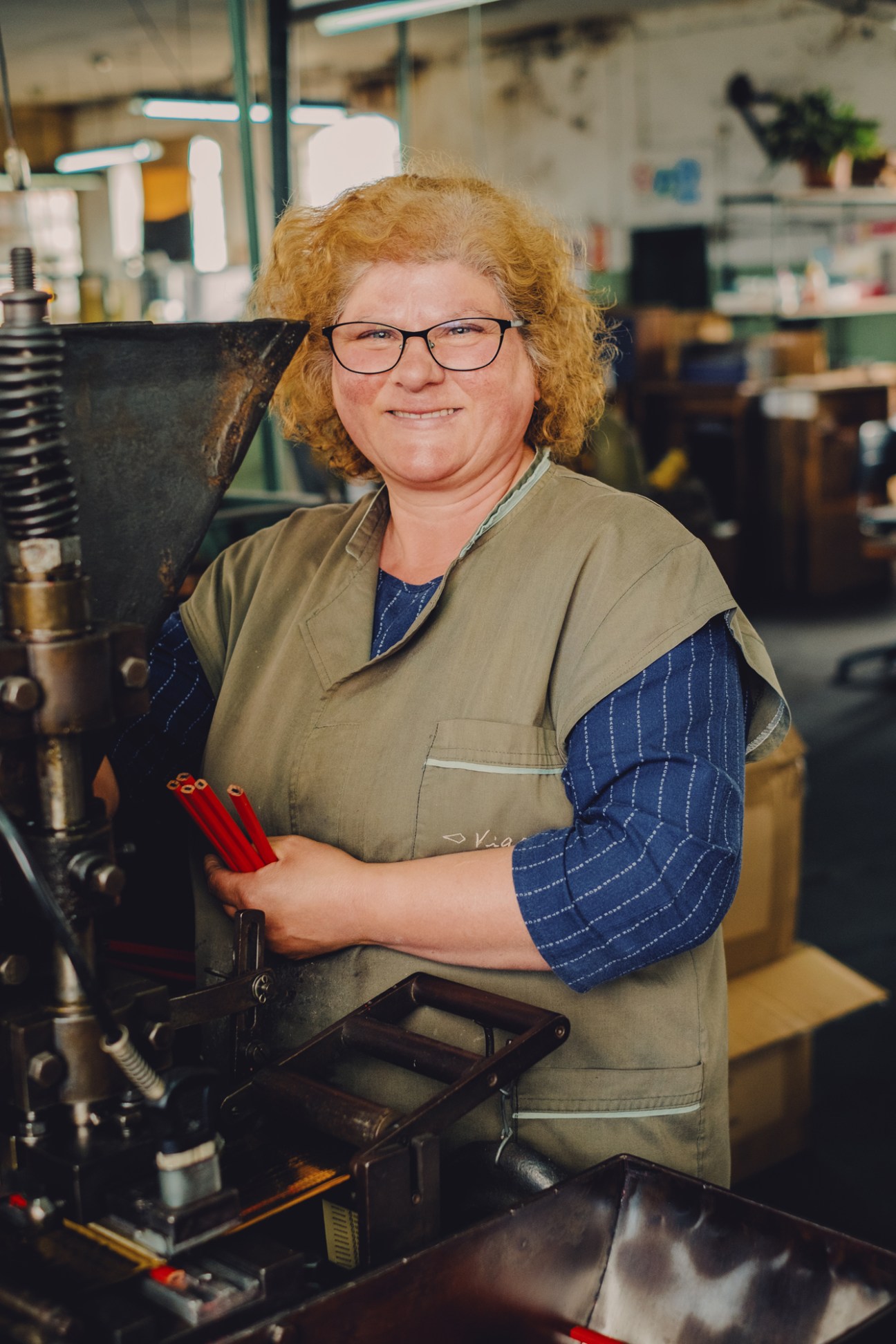 Factory employee Esmeralda Barbosa at the hot-stamp machine