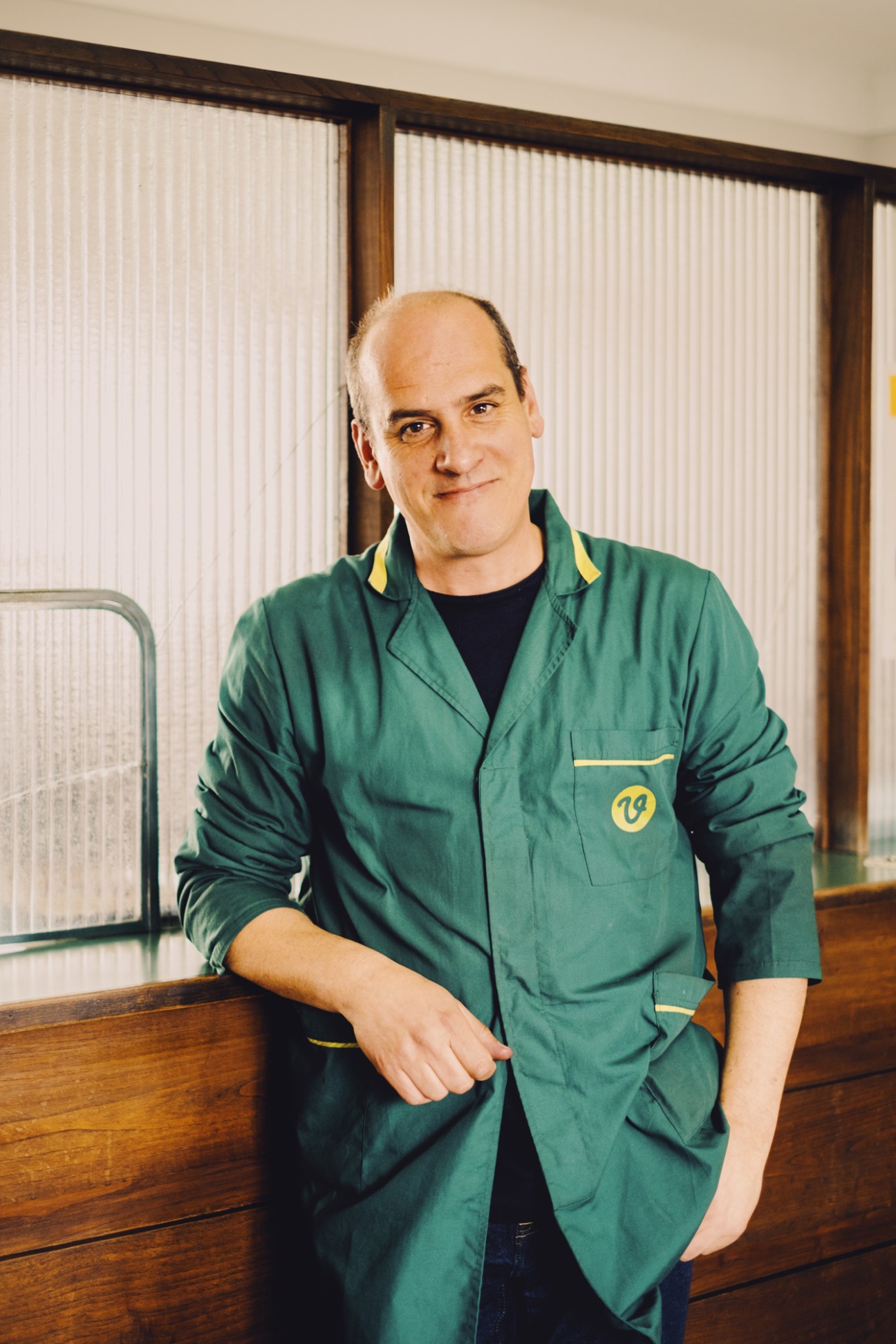 José Vieira, co-owner of Viarco, wearing green work coat in factory office