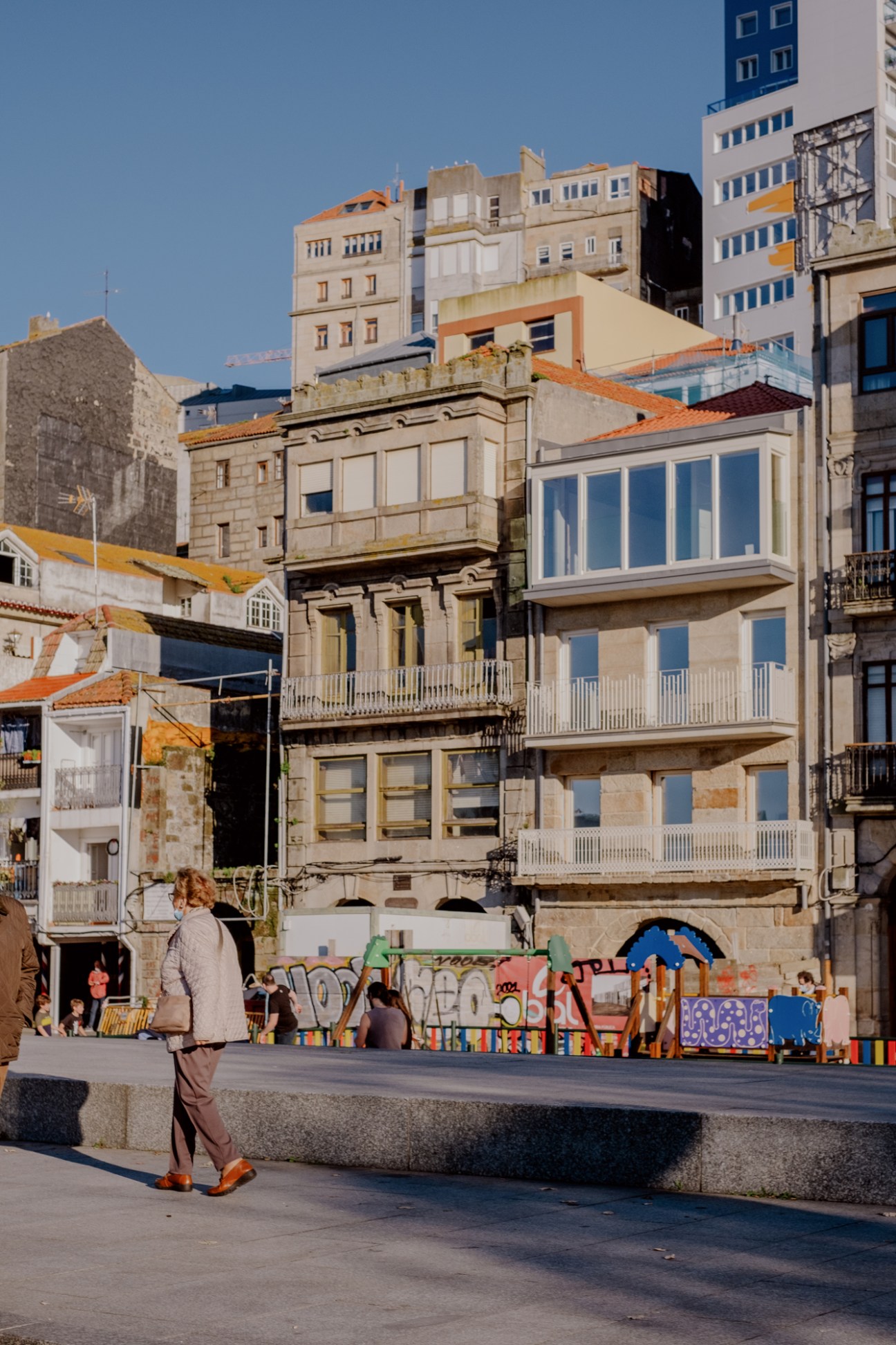 Wide view of Avenida Beiramar waterfront boulevard in Vigo with palm trees and buildings