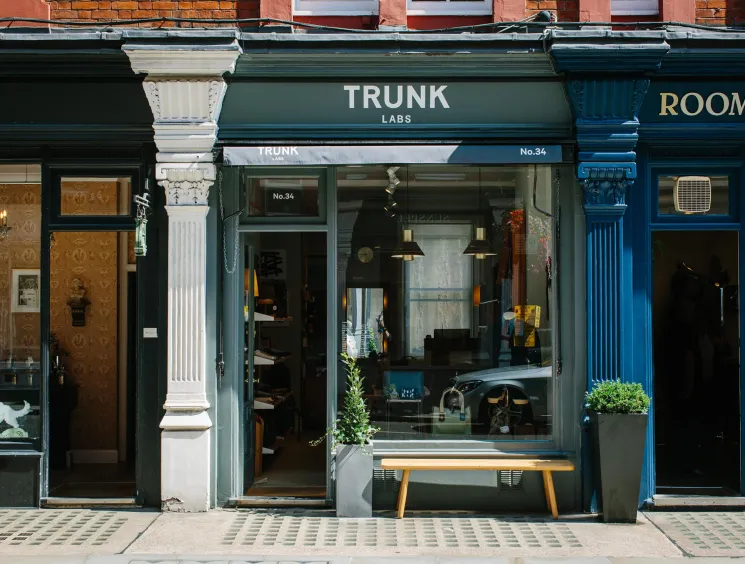 Storefront of Trunk Labs design store with large windows displaying modern furniture and home accessories