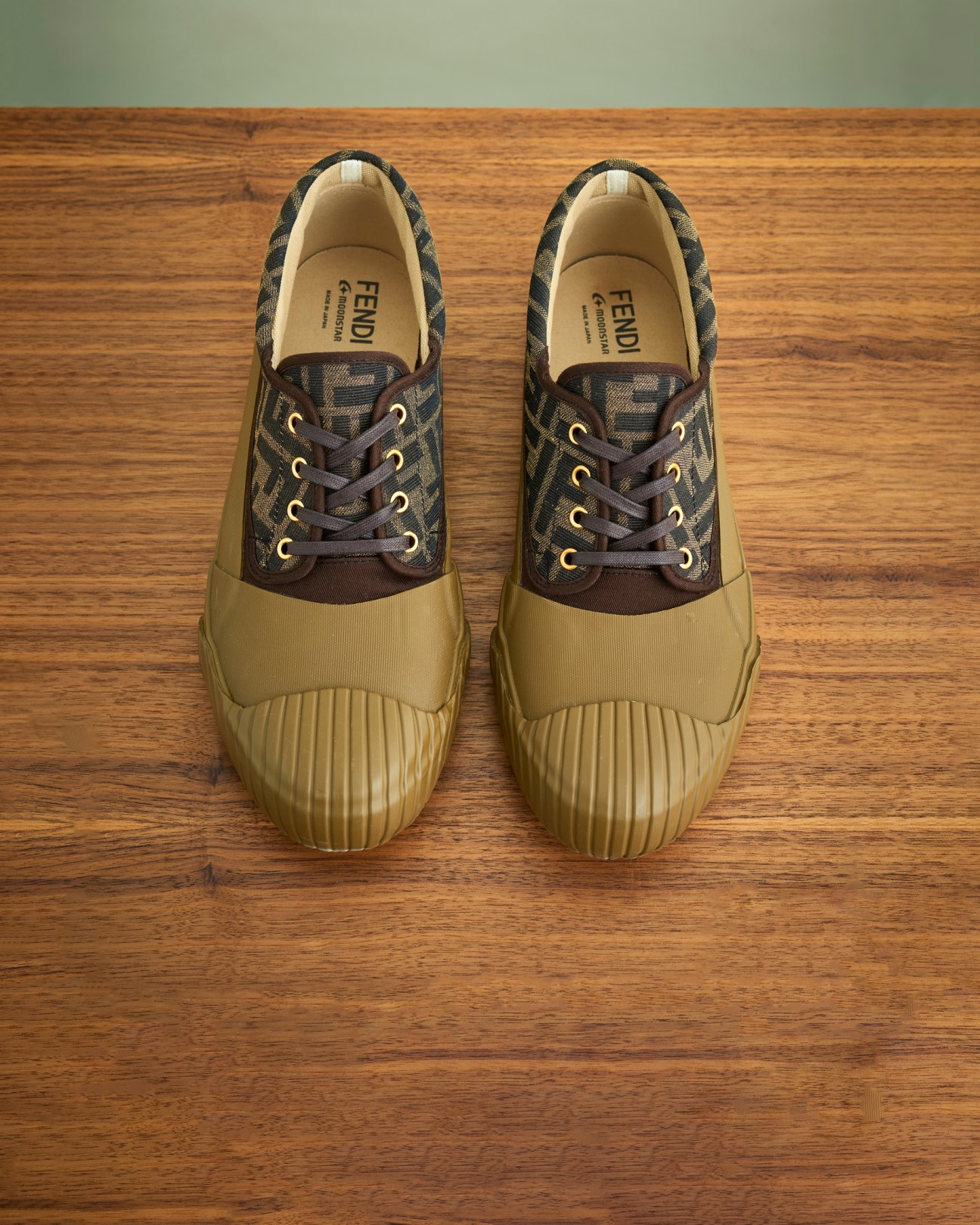 Fendi x MoonStar sneakers with brown and beige colorway on wooden floor