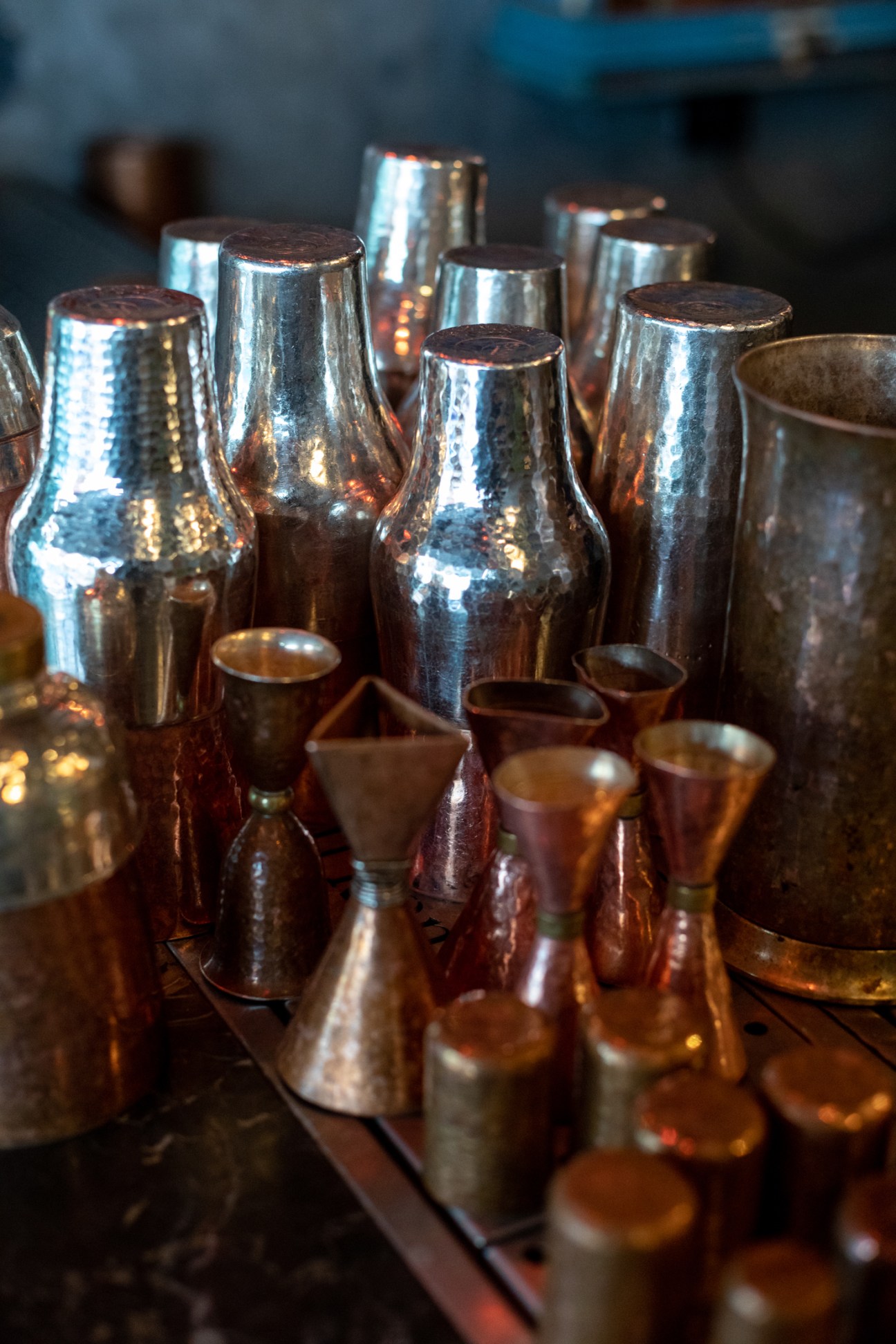 Copper cocktail shakers and vessels displayed at Soy shop