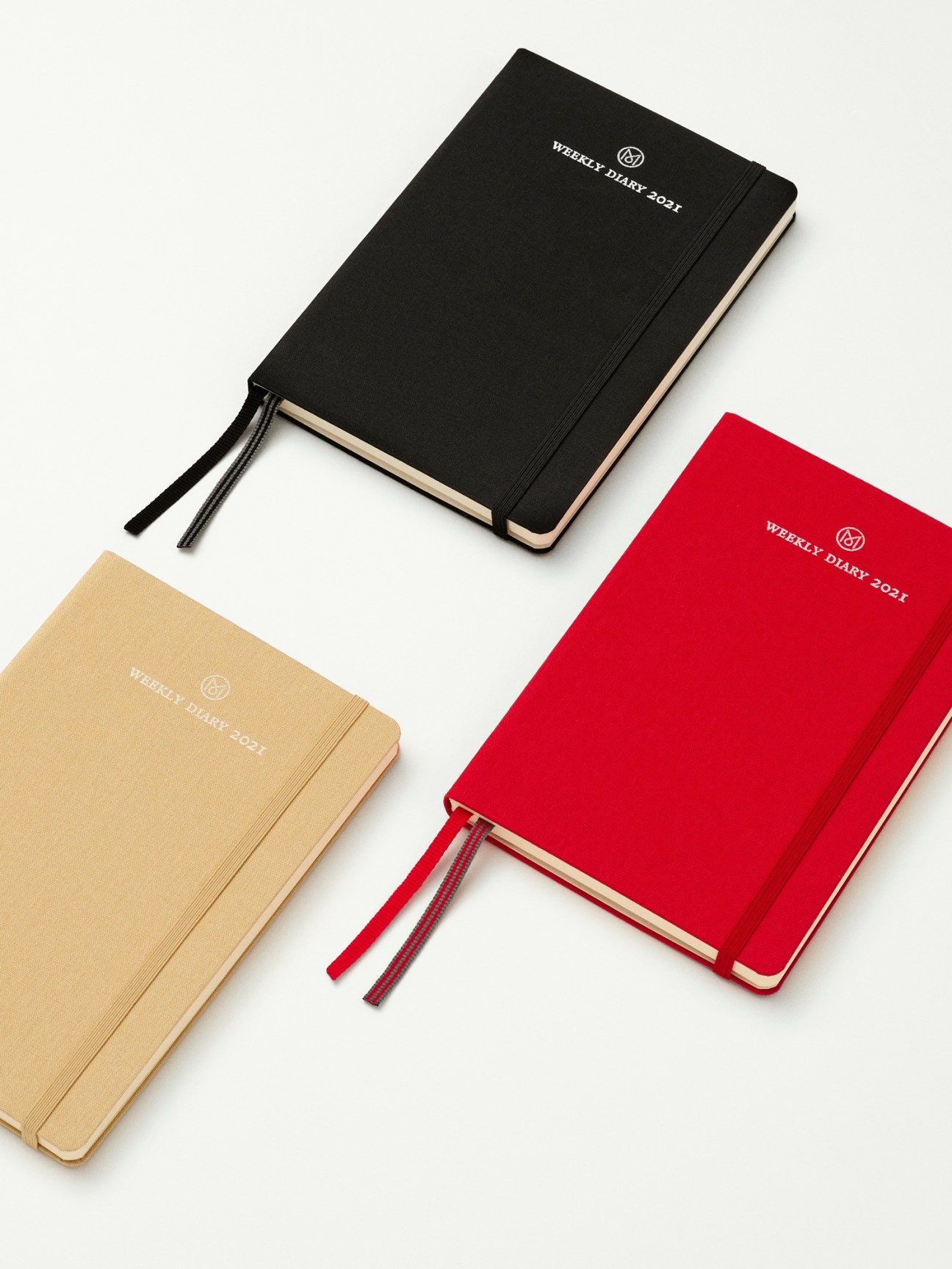 Weekly Diary 2021 by Leuchtturm1917 x Monocle in black, beige, and red hardcover versions with bookmarks.
