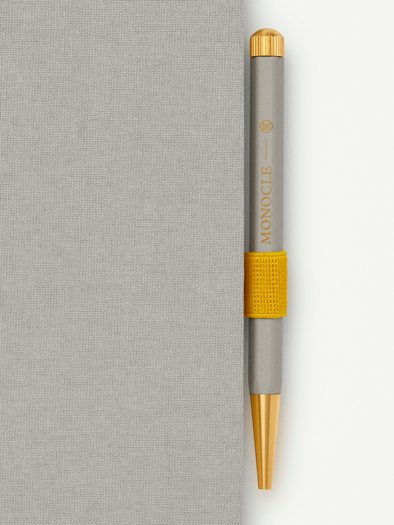 Yellow elasticated pen loop by Monocle x Leuchtturm1917 with self-adhesive backing