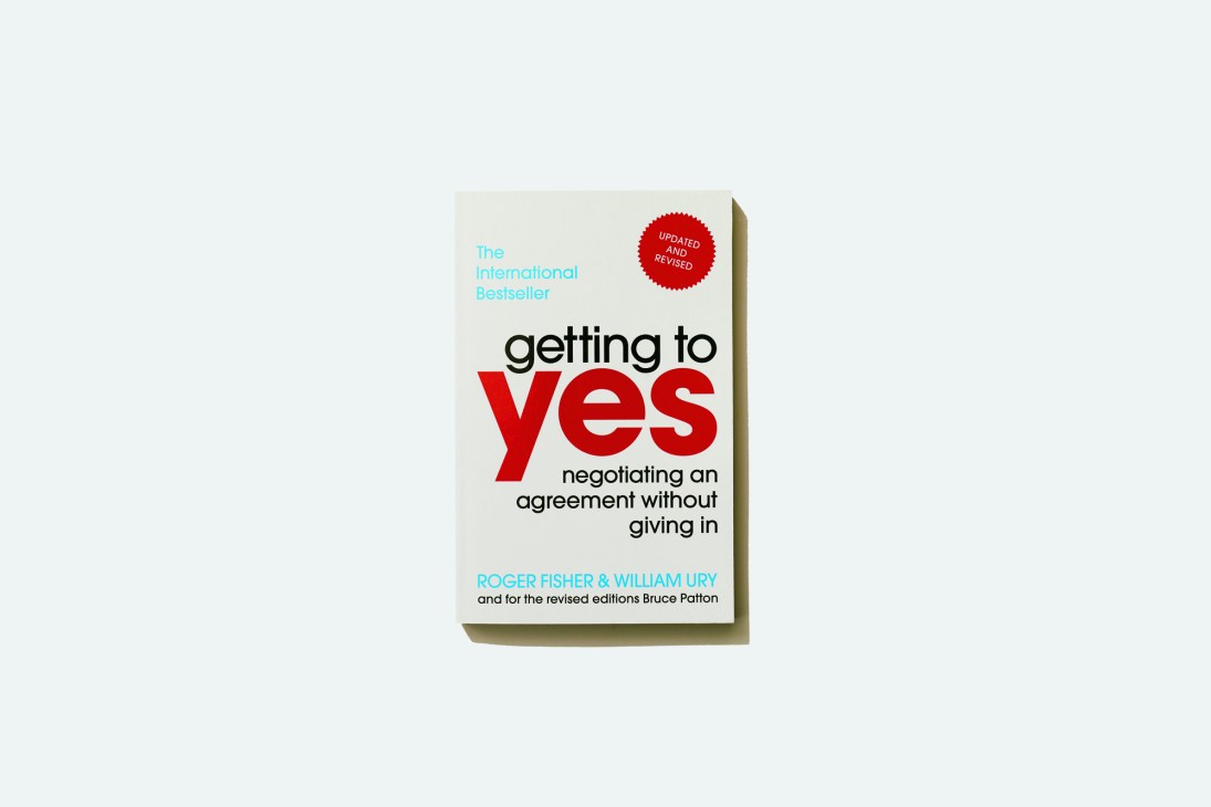 Getting to Yes book cover by Roger Fisher, William Ury and Bruce Patton about negotiating an agreement without giving in.