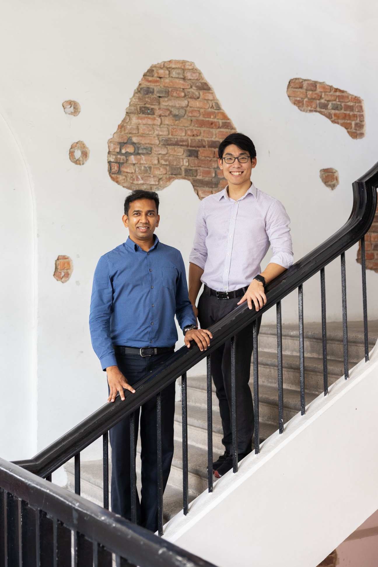 Sivavenayakam and Timothy Choy of Digital Penang standing together in modern office space