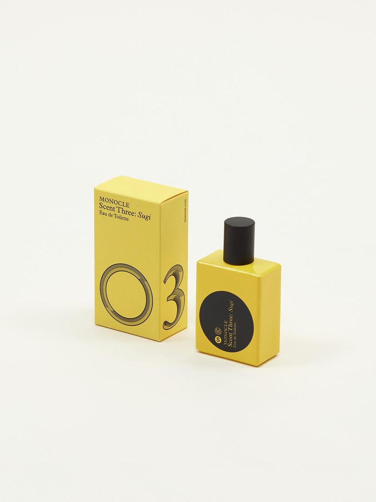 Yellow perfume bottle and box for Comme des Garçons x Monocle Scent Three: Sugi fragrance