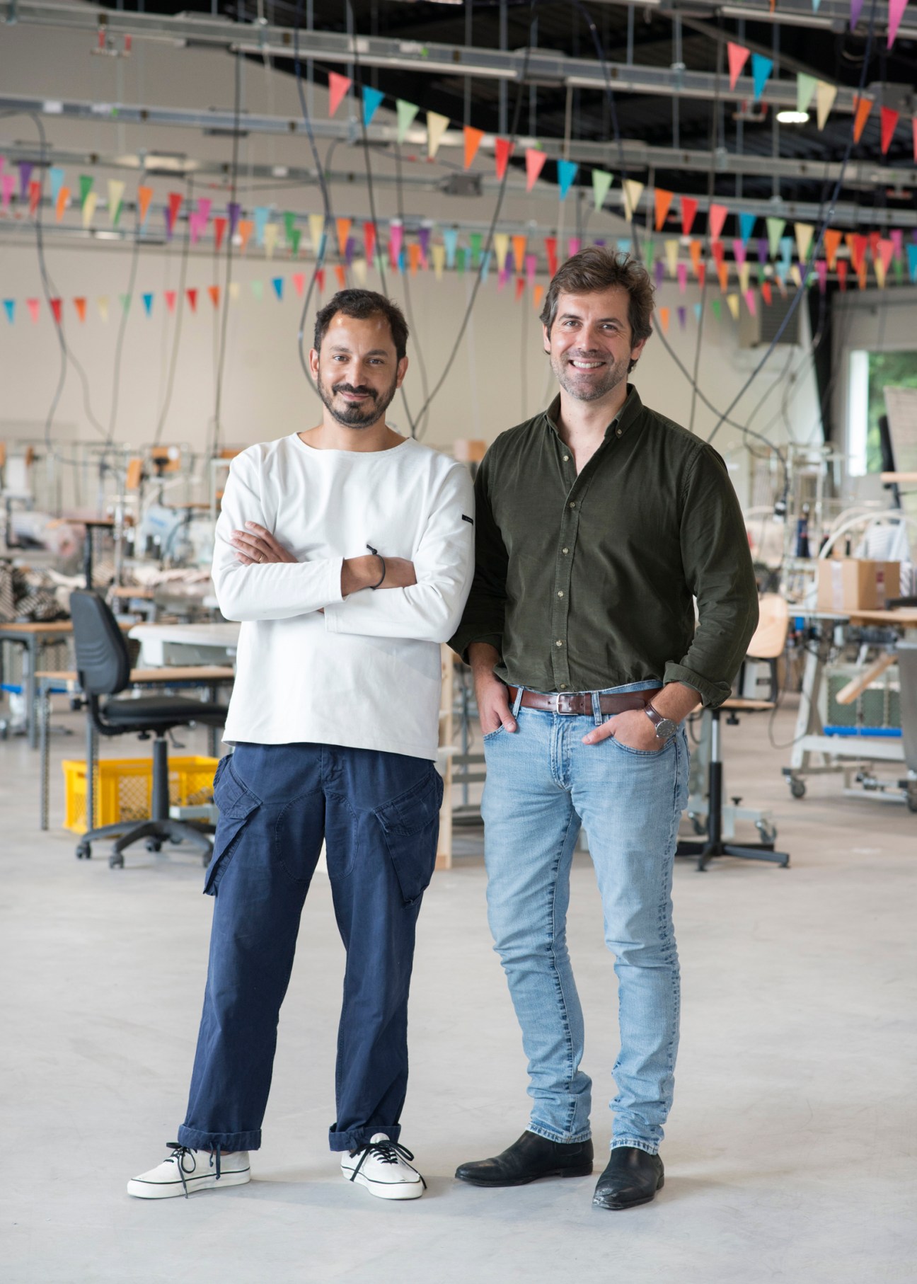 Two men standing together in knitwear factory, Flet on left and Permingeat on right