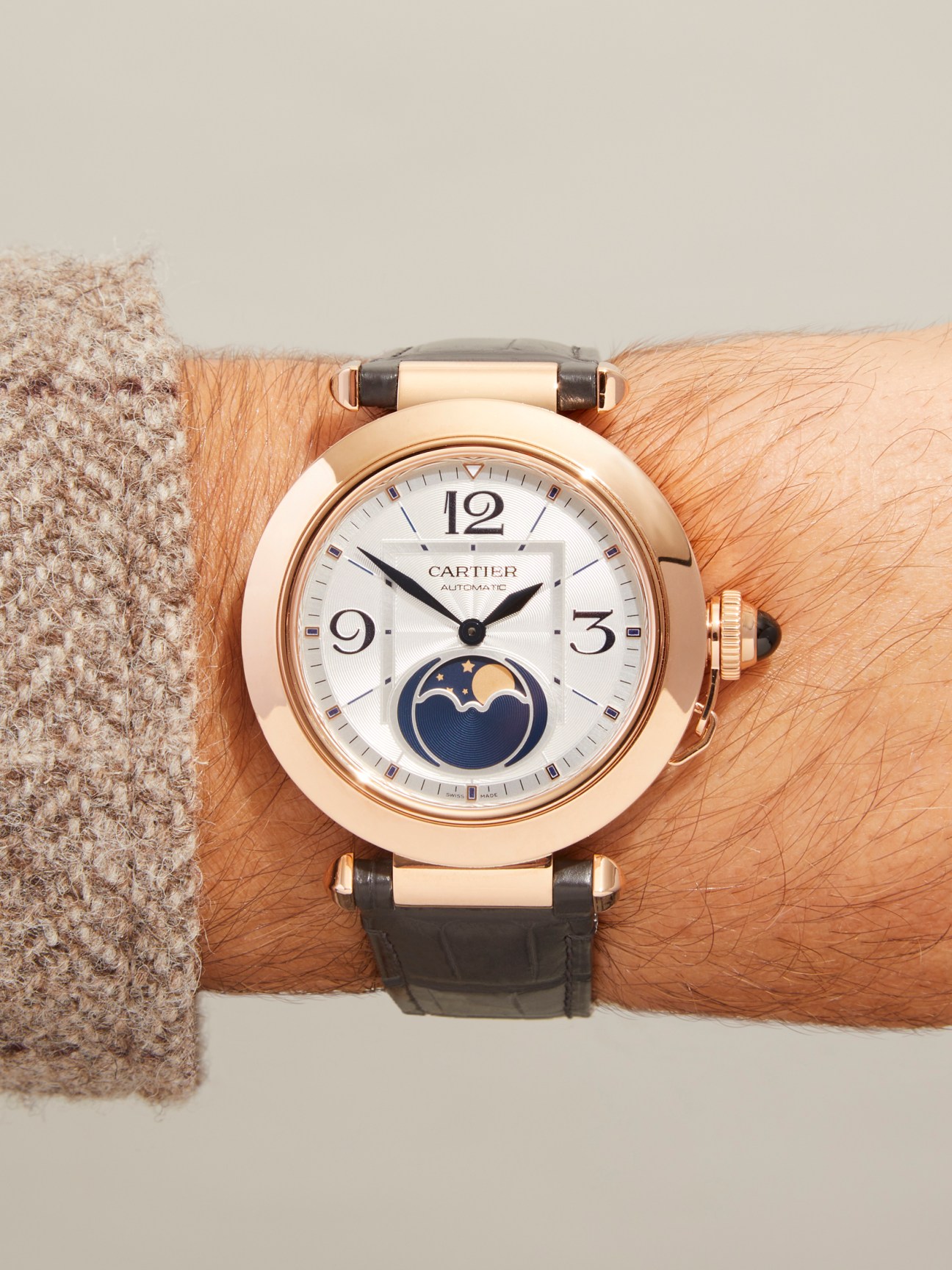Cartier Pasha de Cartier watch with rose gold case, white dial, moon phase complication and black leather strap