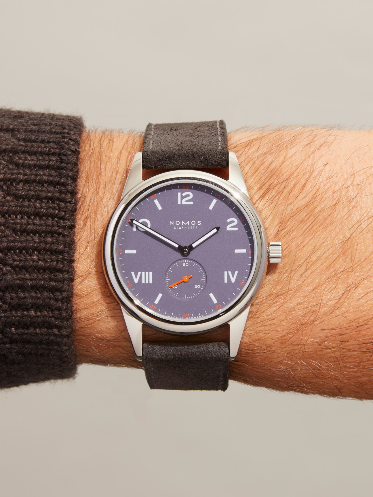 Nomos Glashütte Club Campus 38 watch with purple dial and leather strap worn on wrist