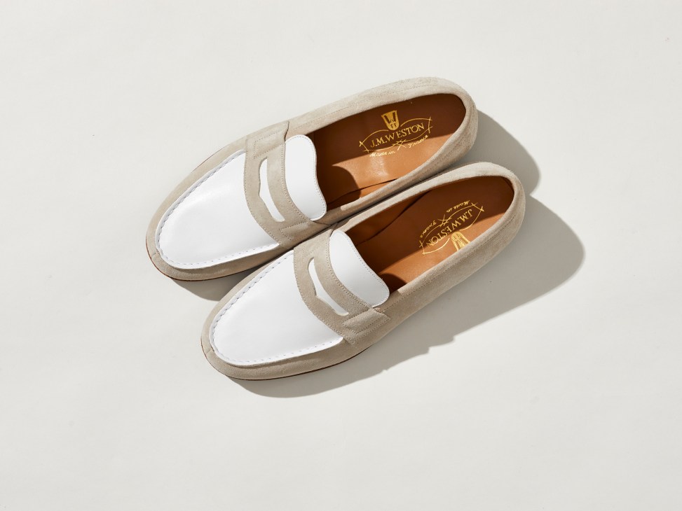 White and beige leather loafers with clean minimalist design by JM Weston on neutral background