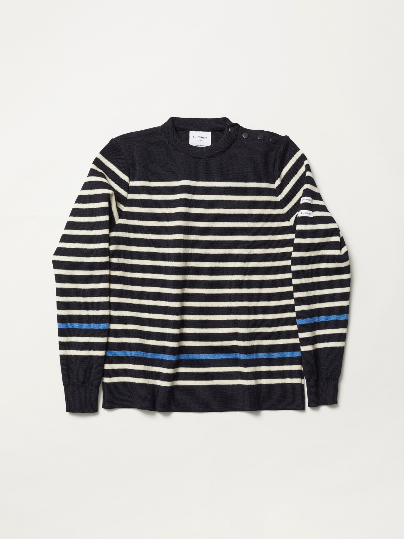 Black and white striped knitted sweater with blue accent stripes