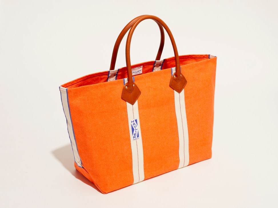 Orange canvas tote bag with white vertical stripes and brown leather handles by Haulier