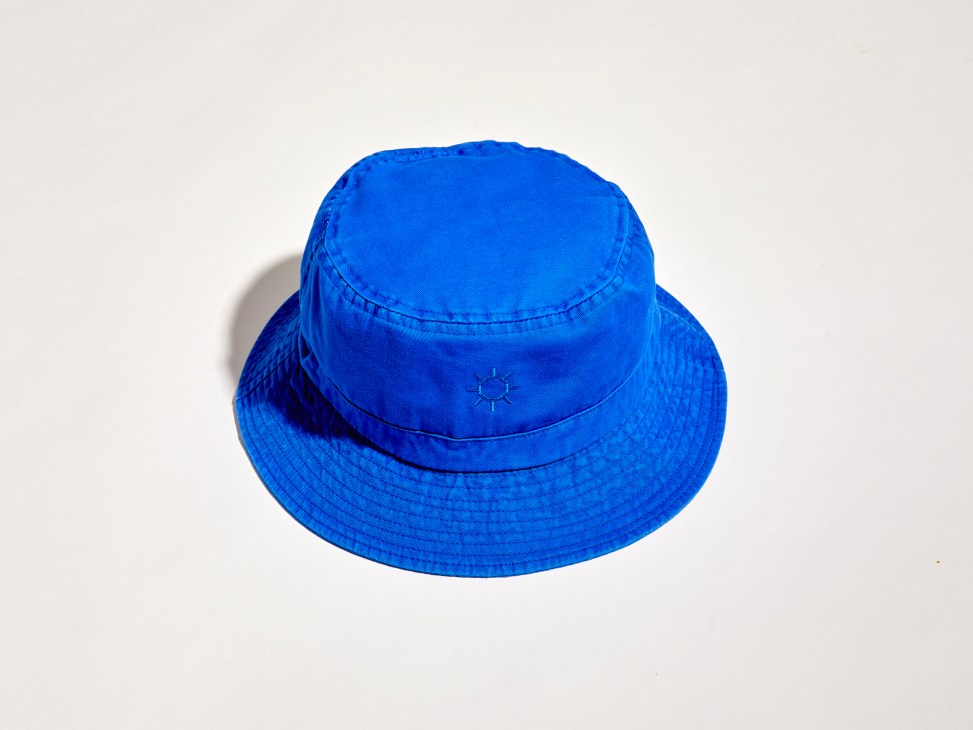 Blue bucket hat with embroidered sun logo on crown