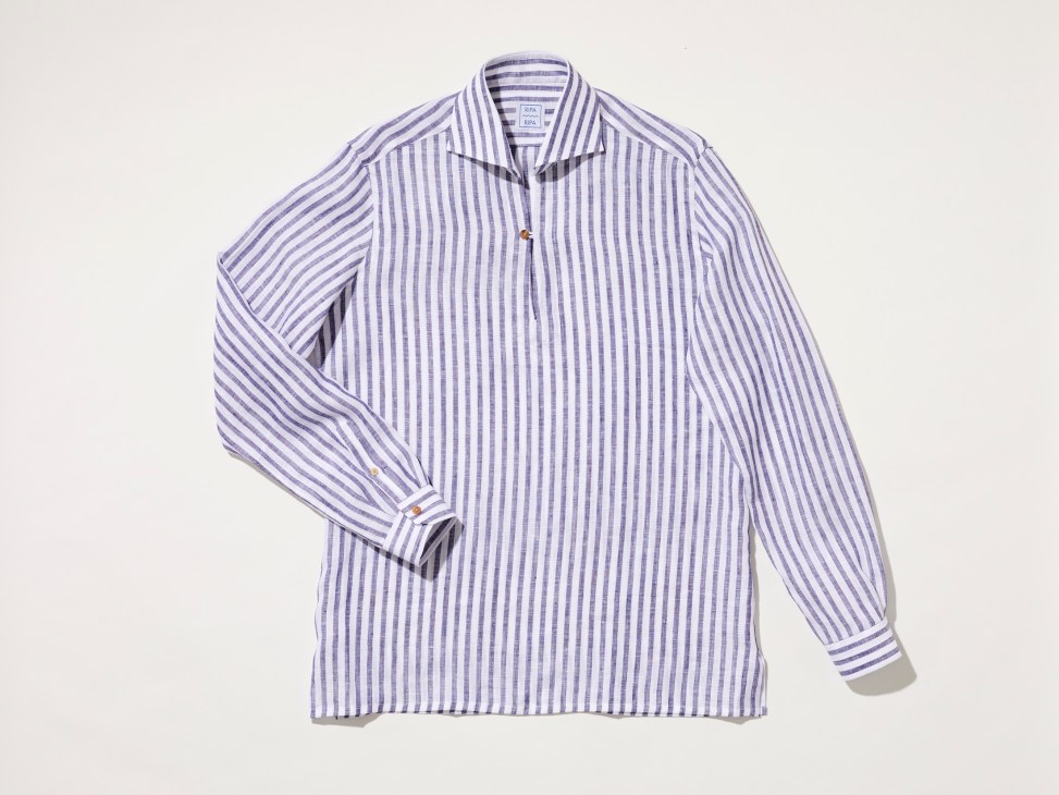 Purple and white striped linen shirt by Ripa Ripa laid flat against light background