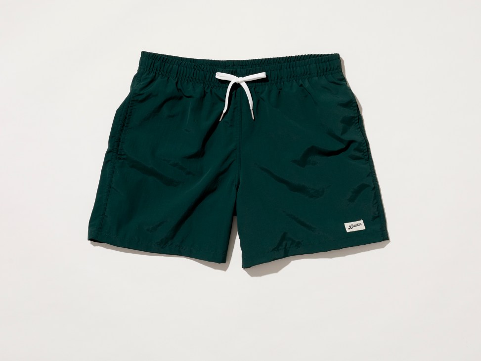 Dark green swim shorts with white drawstring and small white label by Bather