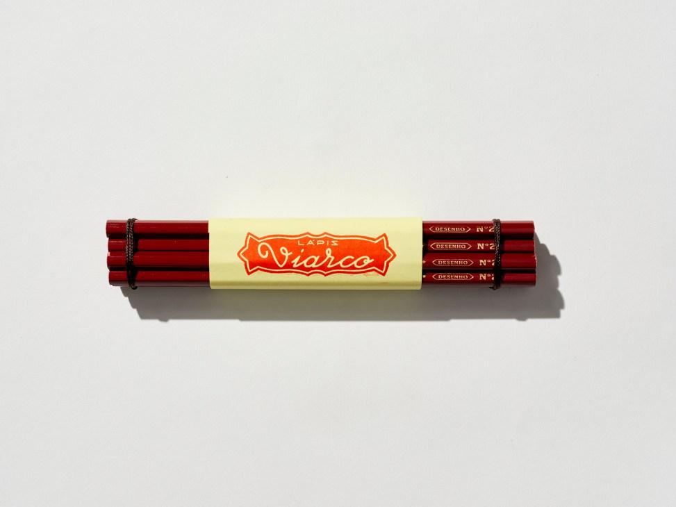 Bundle of red Viarco graphite pencils tied together with yellow paper band showing brand logo