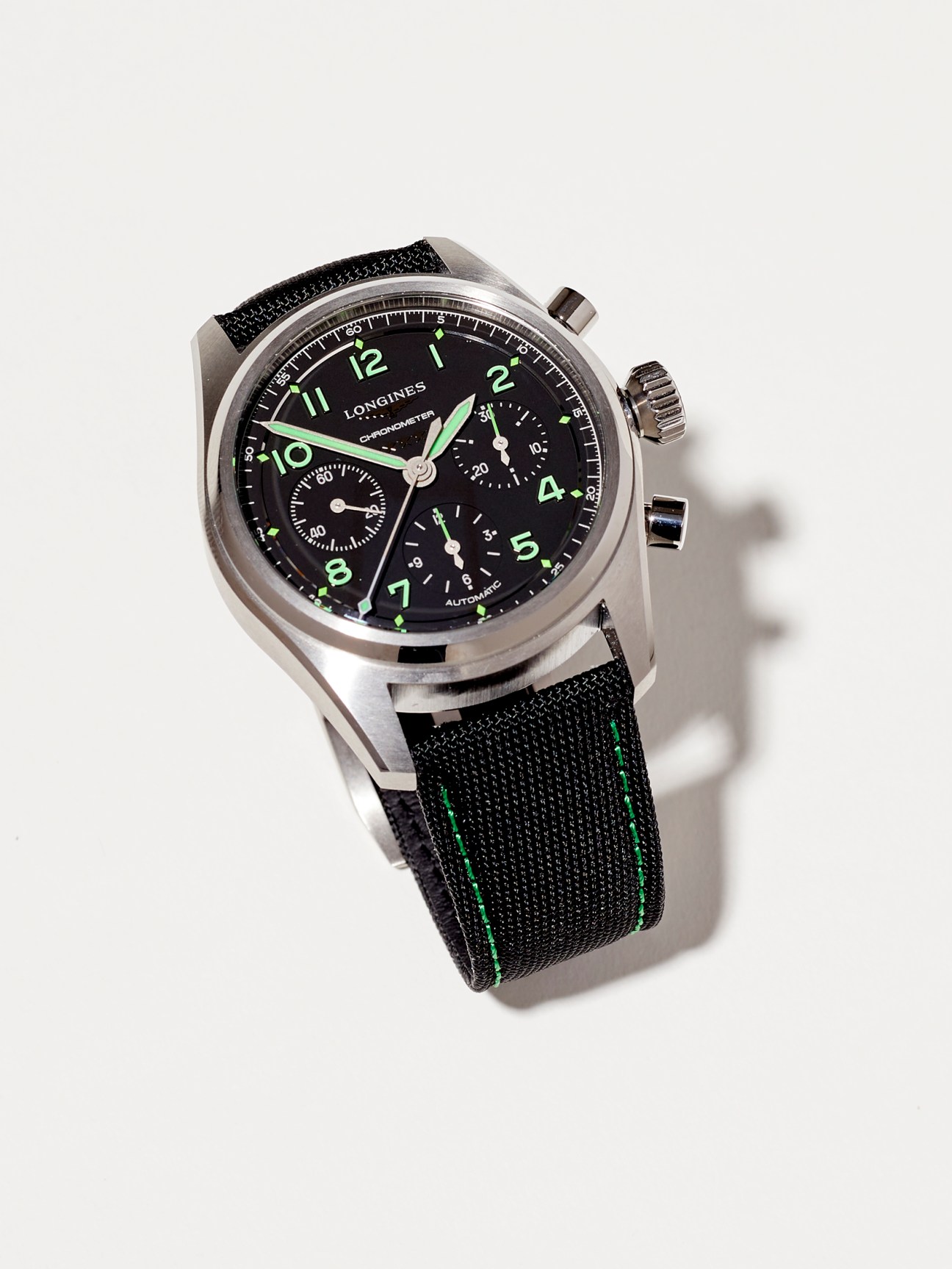 Longines Spirit Pioneer Edition chronograph watch with black dial and green accents on canvas strap