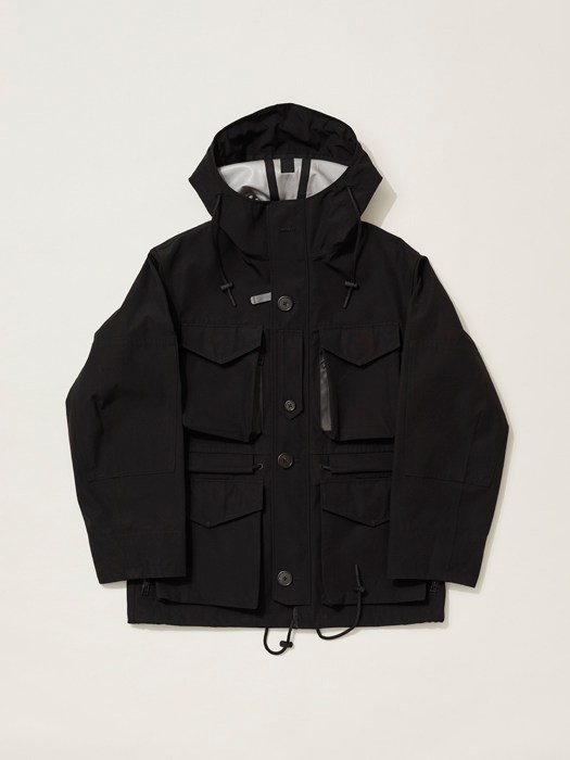 Black technical parka jacket with multiple chest pockets and hood displayed flat on neutral background.