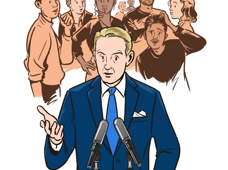 Politician in blue suit speaking at podium with microphones while diverse group of people stand behind him