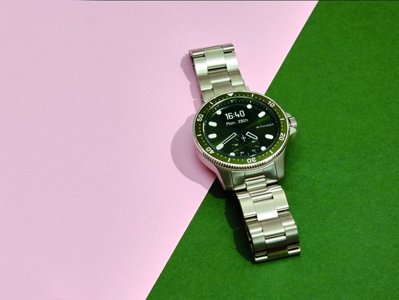 Withings Scanwatch Horizon smartwatch with traditional watch design and metal bracelet on colorful background