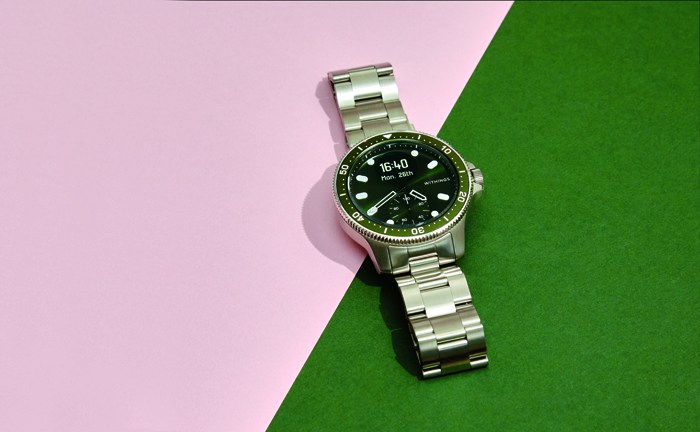 Withings Scanwatch Horizon smartwatch with traditional watch design and metal bracelet on colorful background