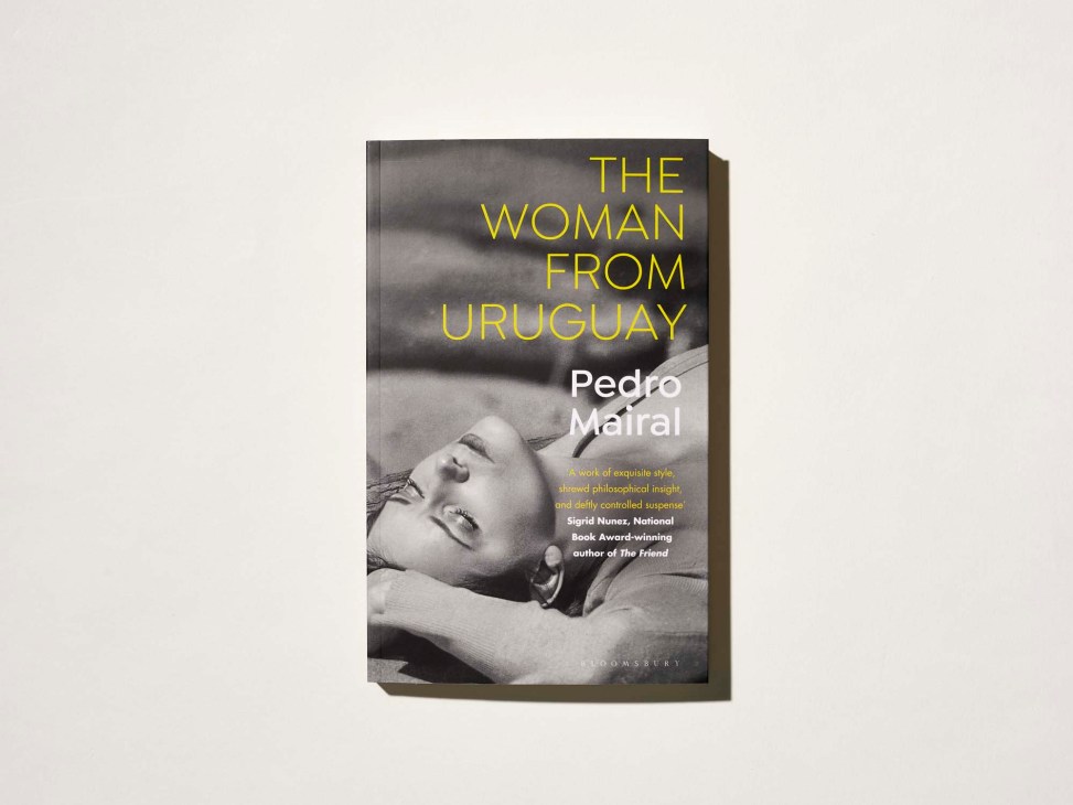 Book cover of 'The Woman from Uruguay' by Pedro Mairal showing a black and white photo of a woman lying down