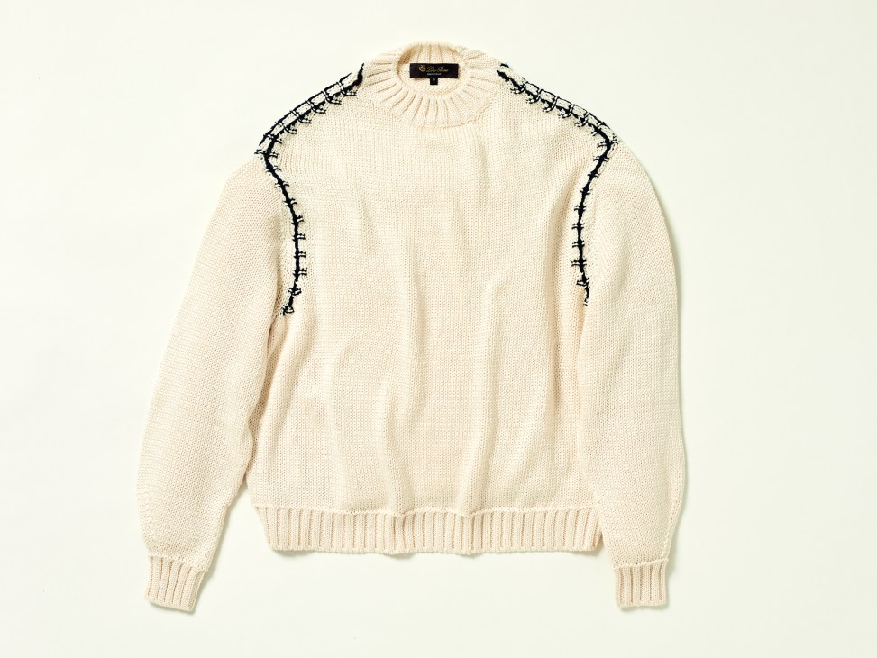 Cream-colored Loro Piana Matira crewneck sweater with black decorative stitching detail along the shoulders