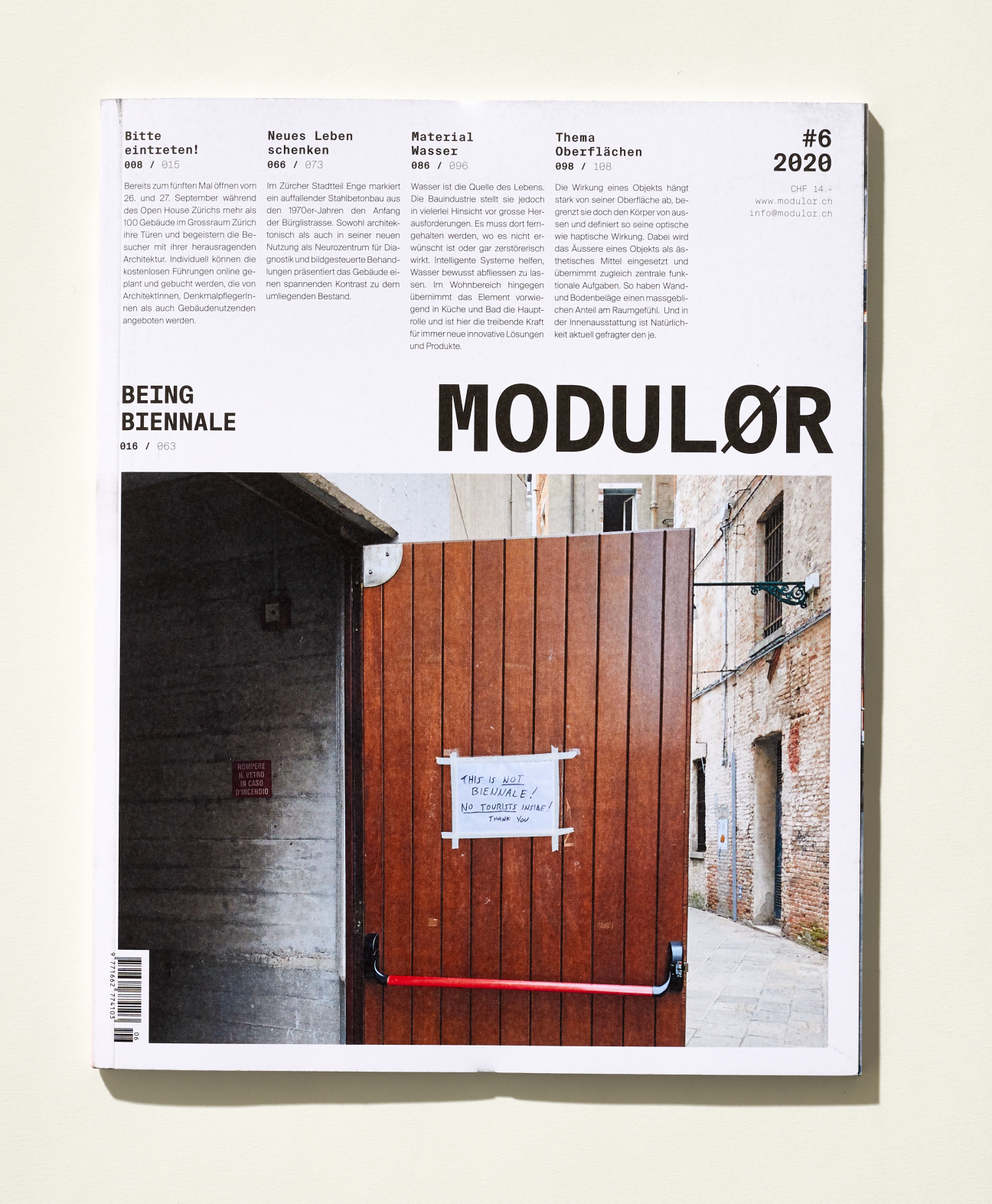 Cover of Modulør magazine issue 6 from 2028 featuring architectural photography of a red wooden door.