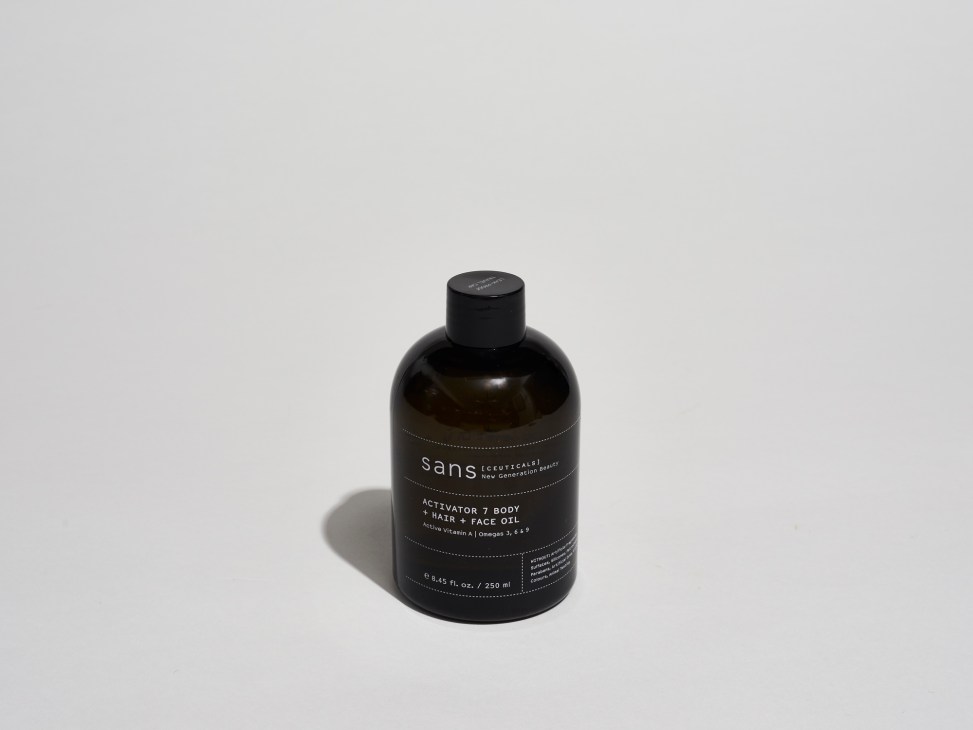 Sansceuticals Activator 7 body, hair and face oil in a dark glass bottle with black cap.