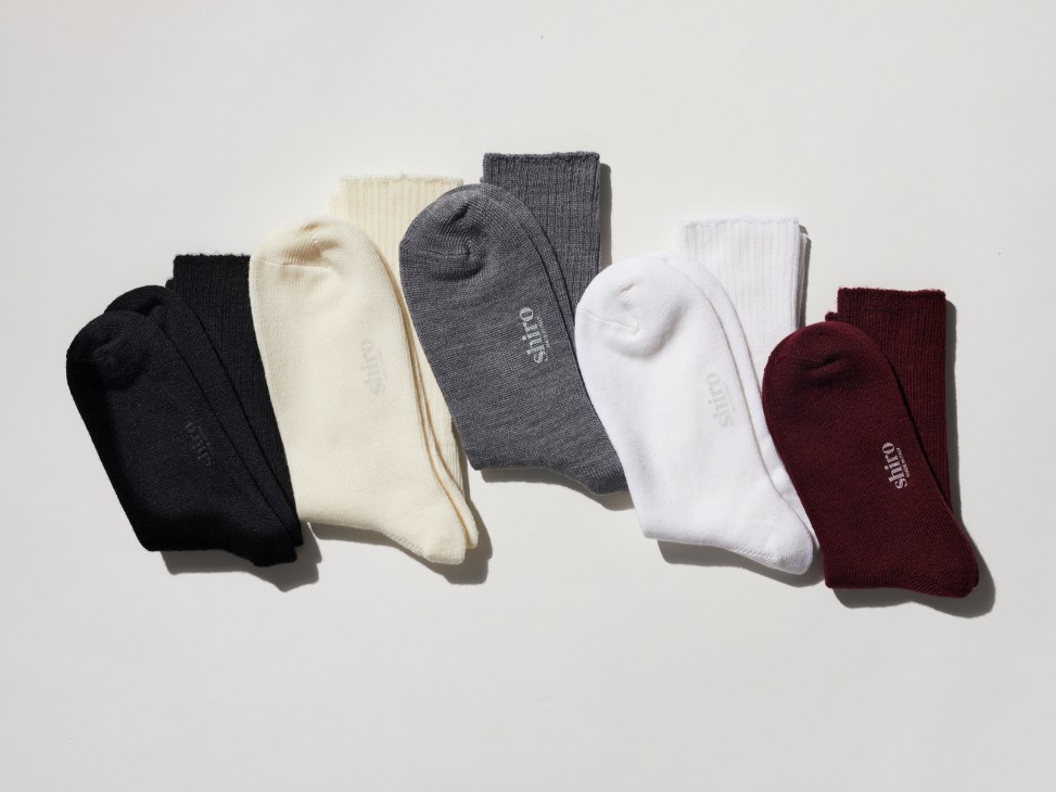 Close-up of Shiro merino wool socks in neutral colors showing fine Italian craftsmanship and sports-inspired design