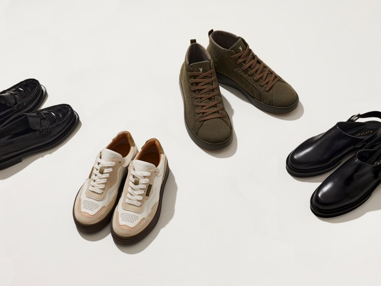 Four pairs of shoes displayed on white background: black loafers, cream and tan trainers, olive lace-up boots, and black mules.