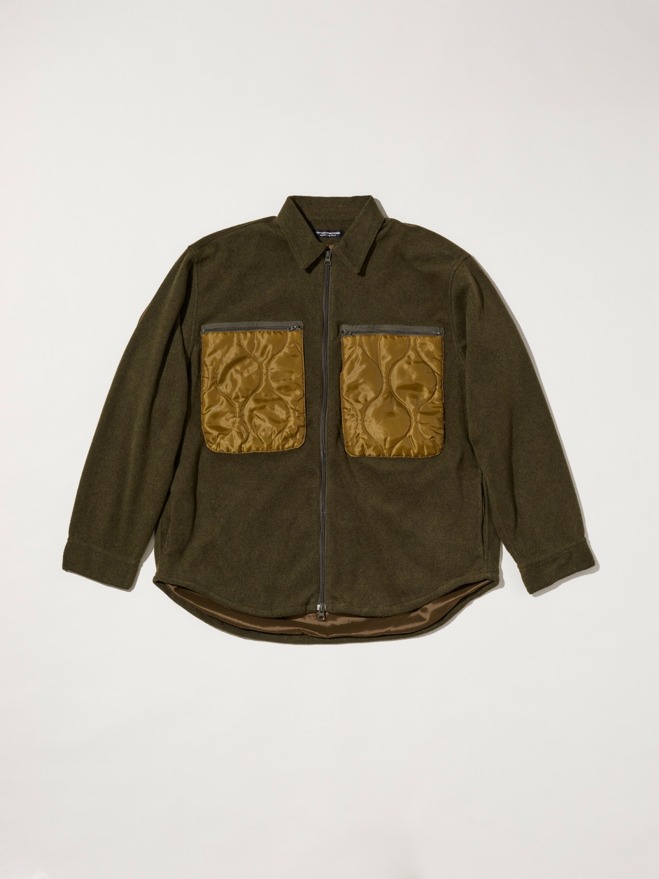 Forest-green fleece blouson with satin front pockets by Japanese label Fujito