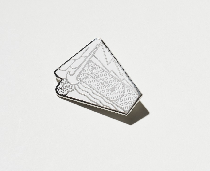 Roy Lichtenstein pin with abstract design on white background