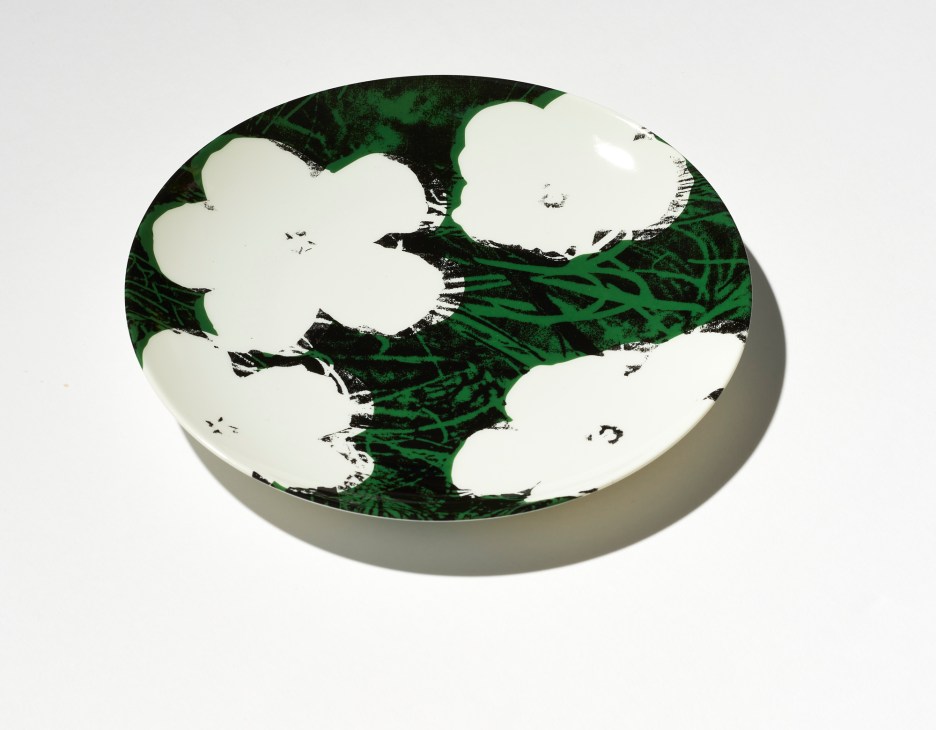 Andy Warhol plate with cream-colored cloud shapes on dark green and black textured background
