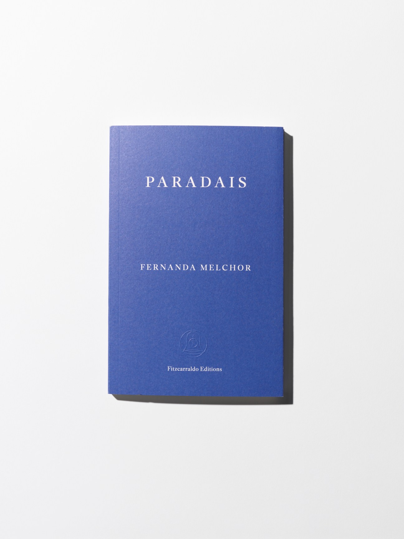 Blue book cover of Paradais by Fernanda Melchor published by Fitzcarraldo Editions