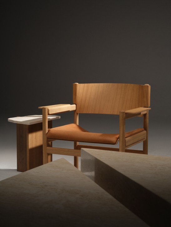 Rhea side table with irregular leaf-inspired silhouette, solid wood base and natural limestone top