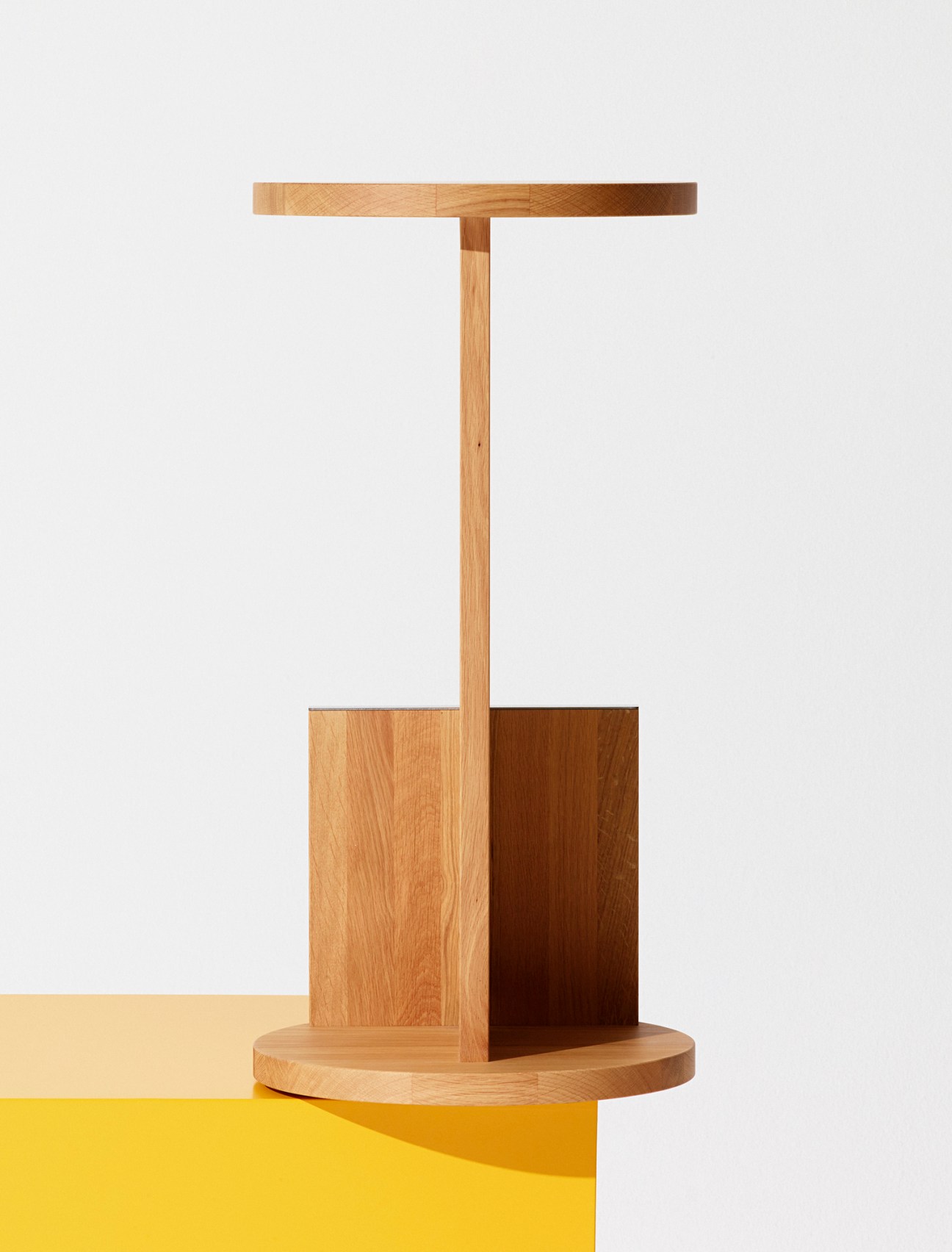 Tank Stool by David Thulstrup in natural hardwood with integrated metal-lined footrest.