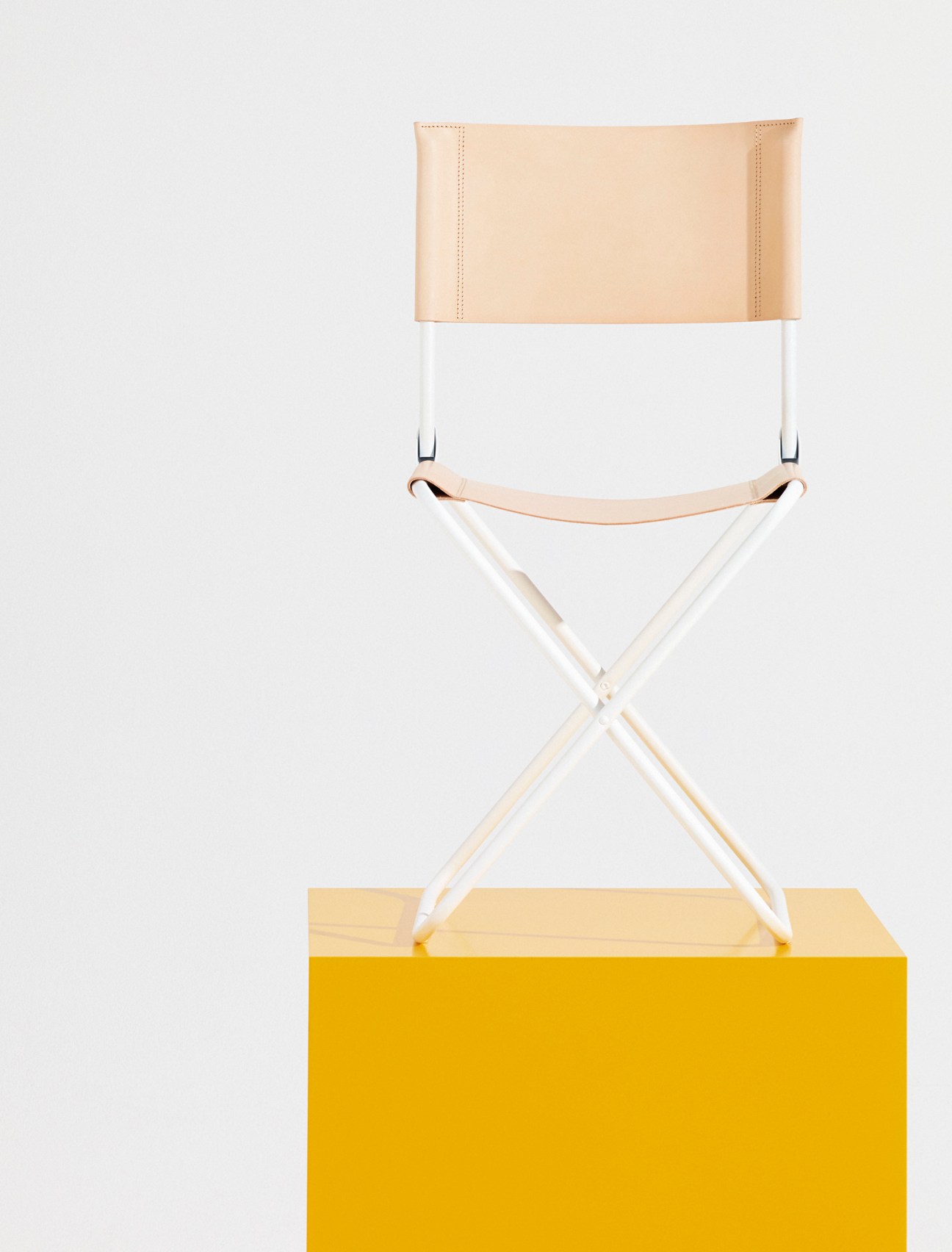 Close-up detail of the LaFuma x Bleu de Chauffe chair showing leather craftsmanship