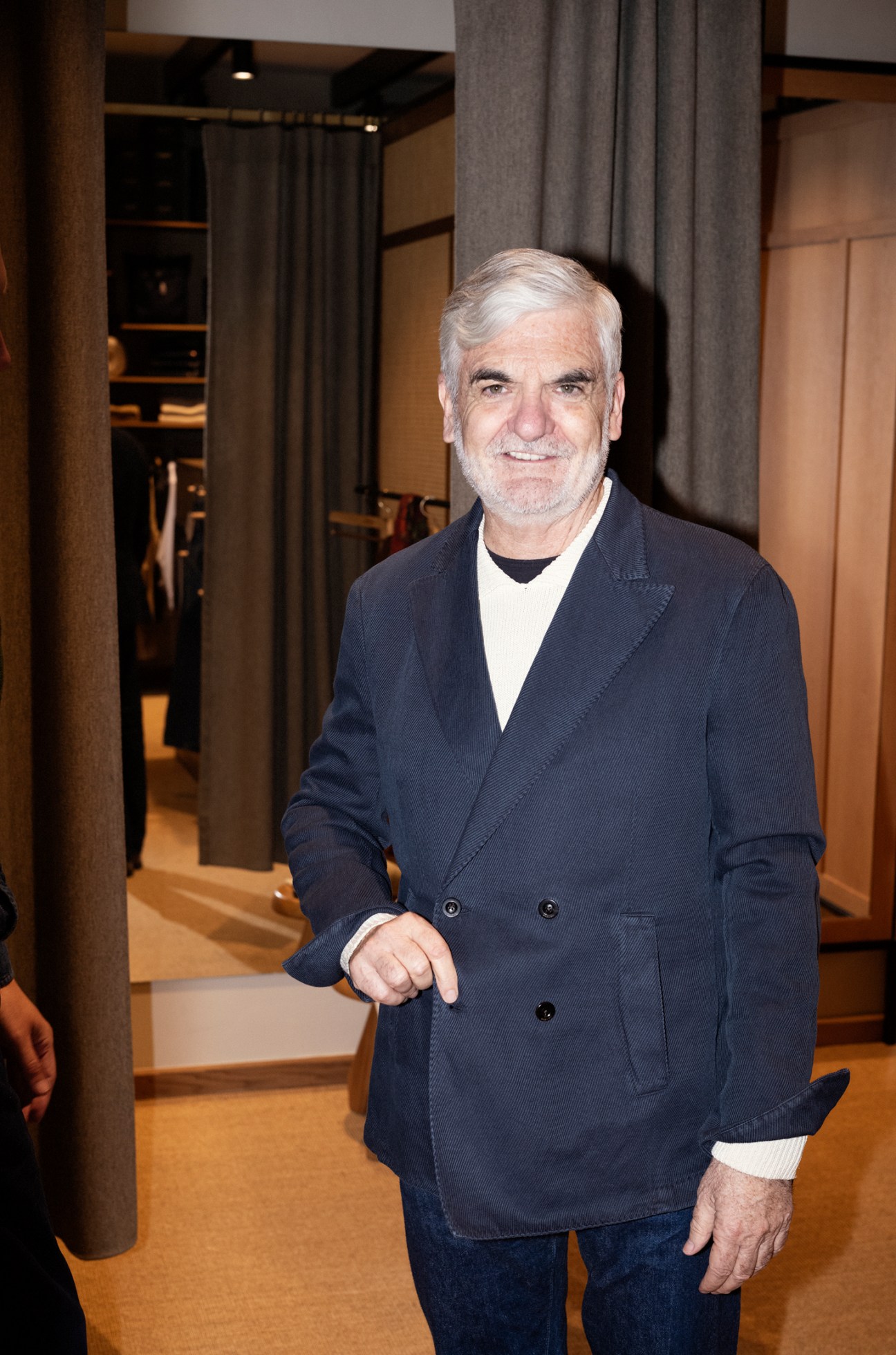 Customer Mitchell Dean wearing a Boglioli jacket in modern menswear store