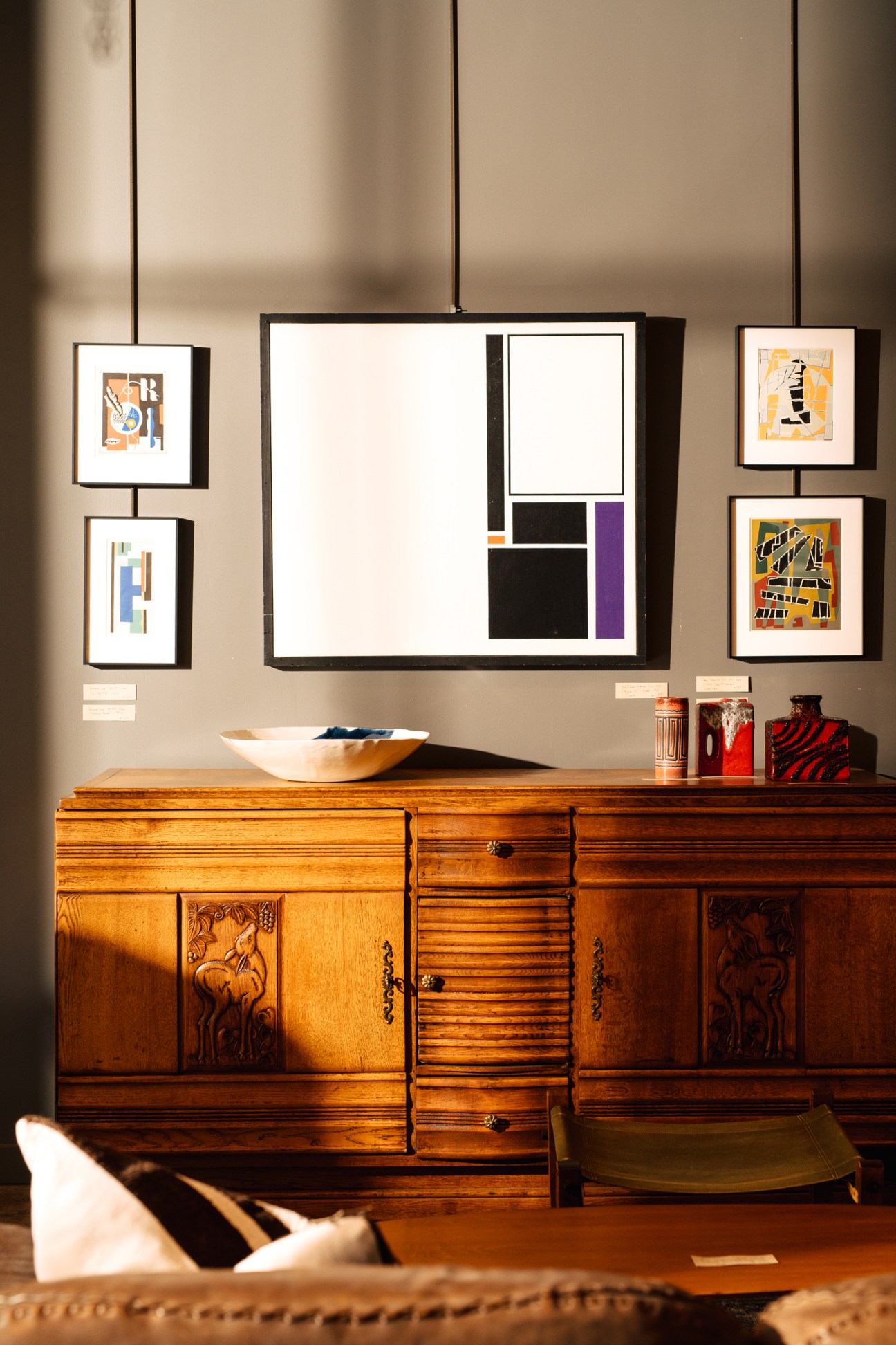 Mid-century wooden furniture and home accessories displayed in an interior retail setting