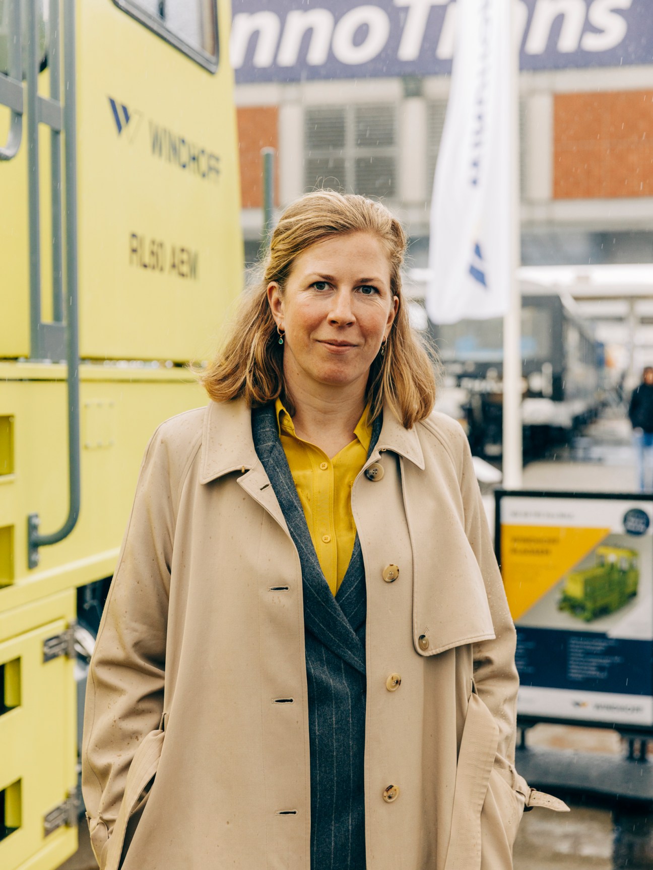 Anne-Marie Grossmann from GMH Gruppe standing in beige coat at trade fair