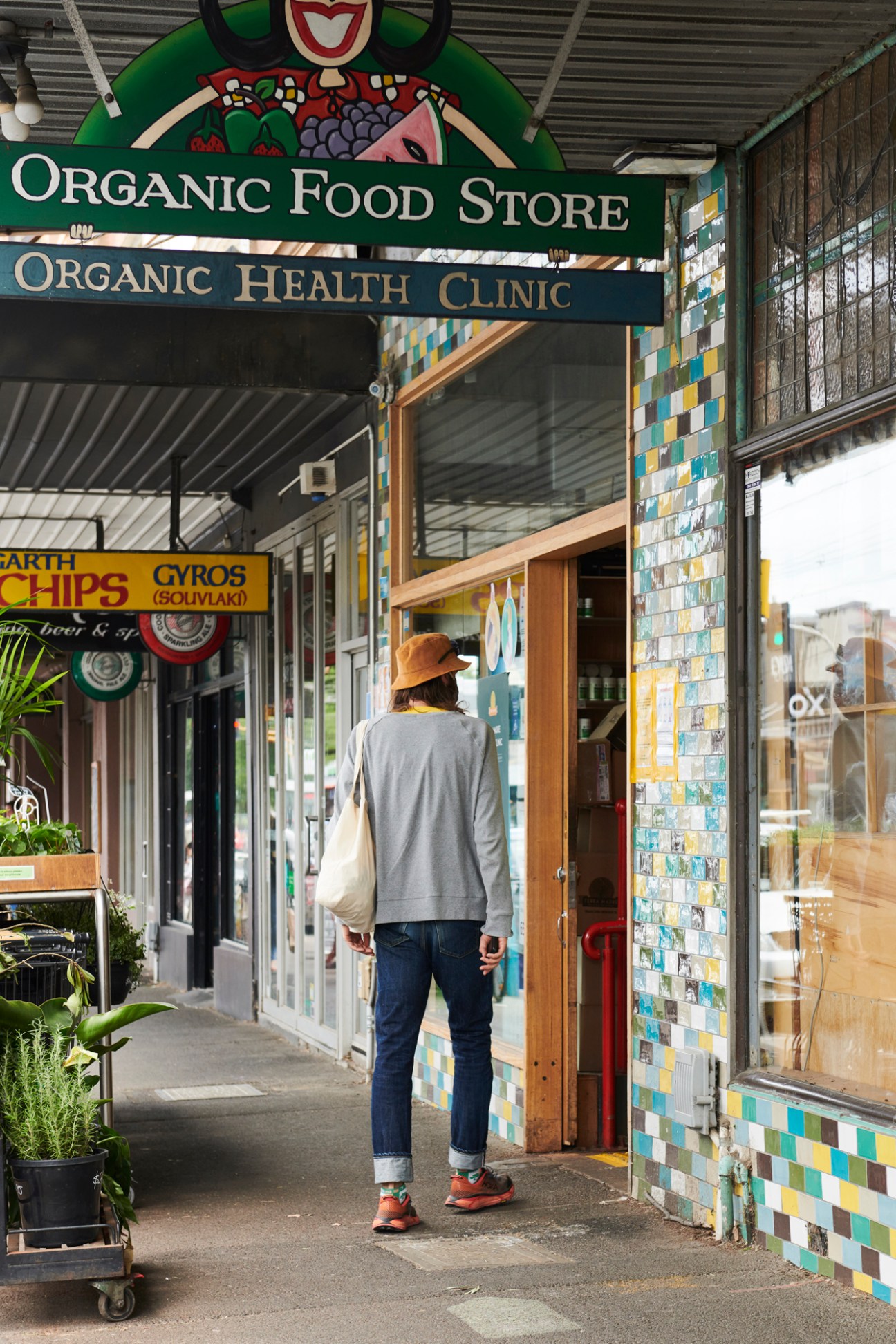 Person entering Terra Madre organic food store and health clinic on Melbourne's High Street.