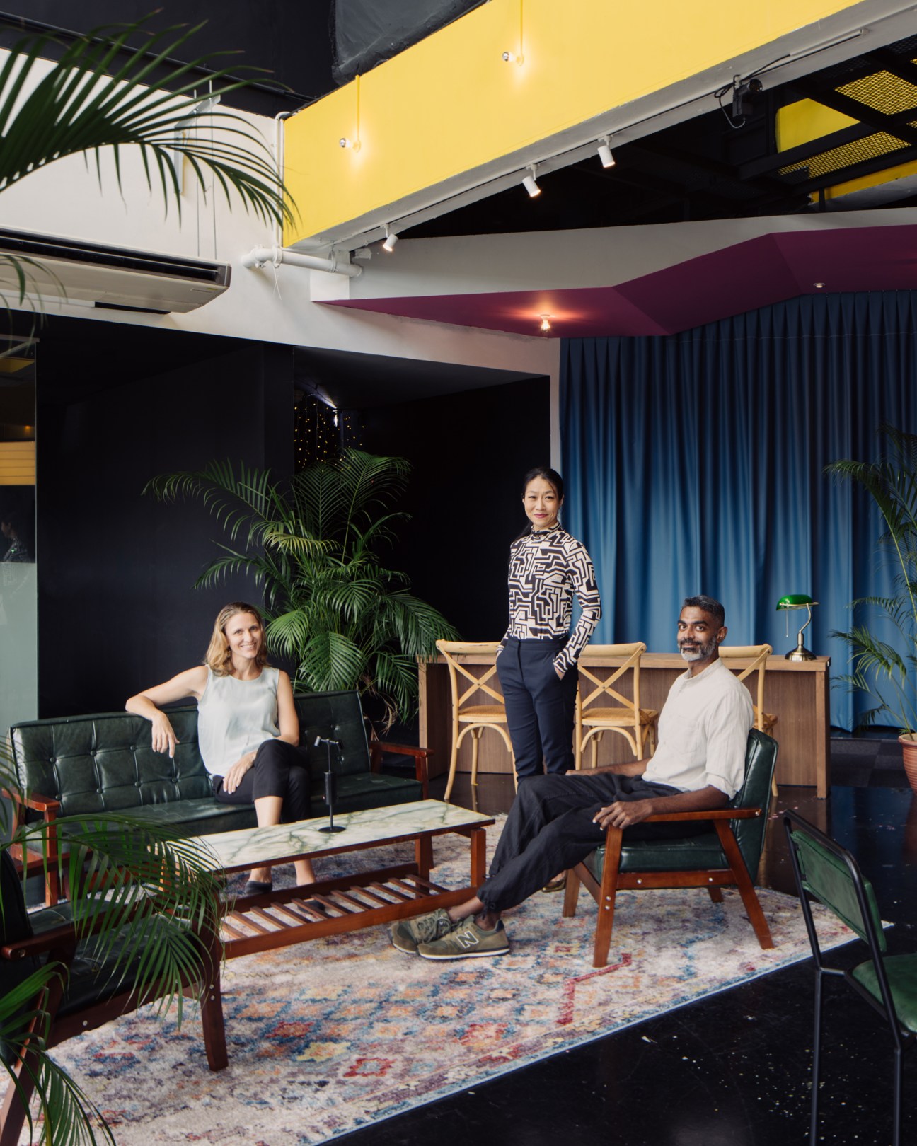 Karen Tan (centre) with co-founder Blaise Trigg-Smith and general manager Prashant Somosundram in Projector X: Riverside's lounge area.